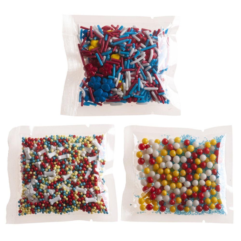 Tre poser med Paw Patrol kakestrø med poteavtrykk, hundebein og sukkerperler