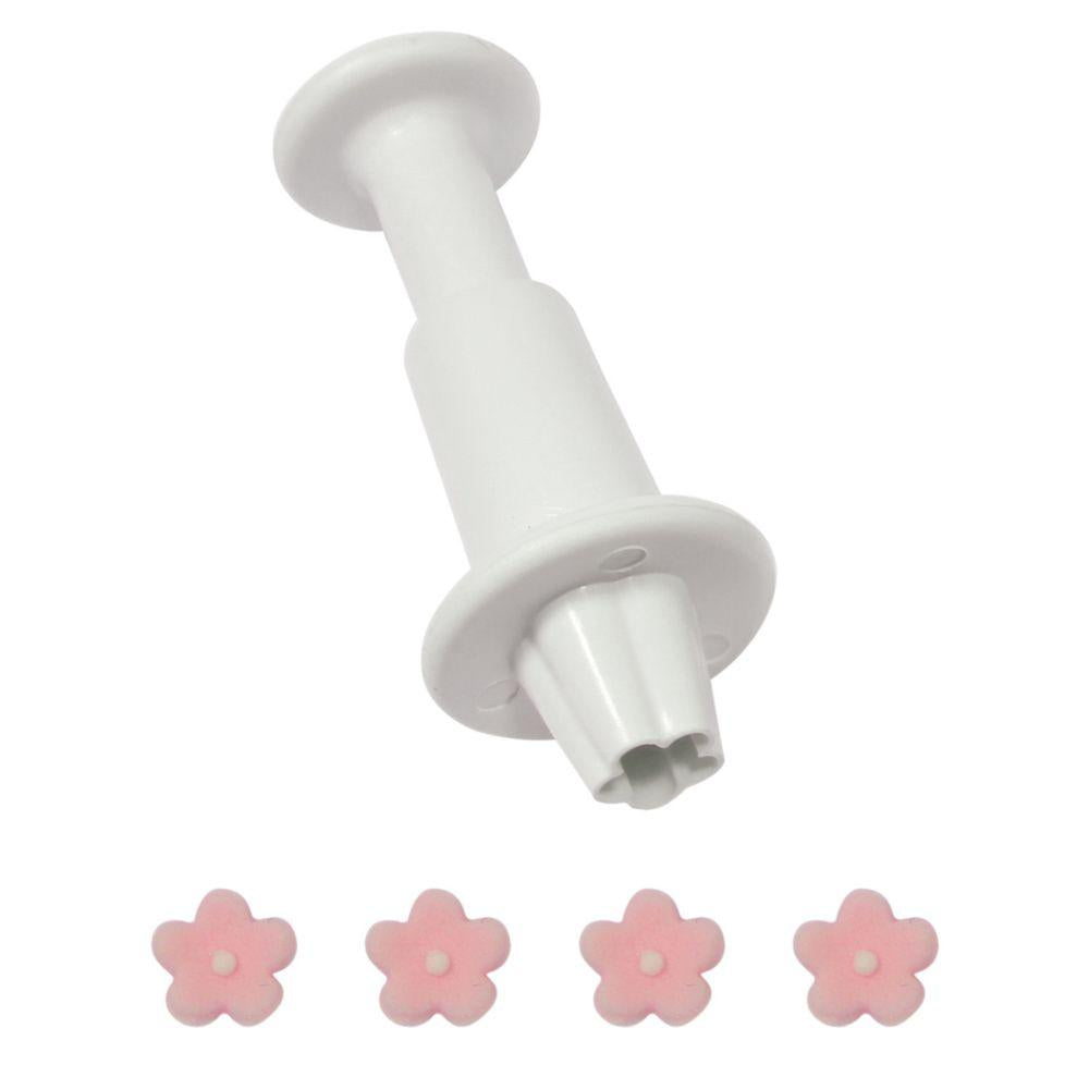 Rosa fondantblomster laget med liten PME blomster utstikker