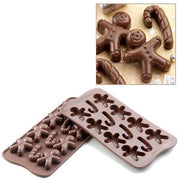 Konfektform med små pepperkakemenn og julestokk