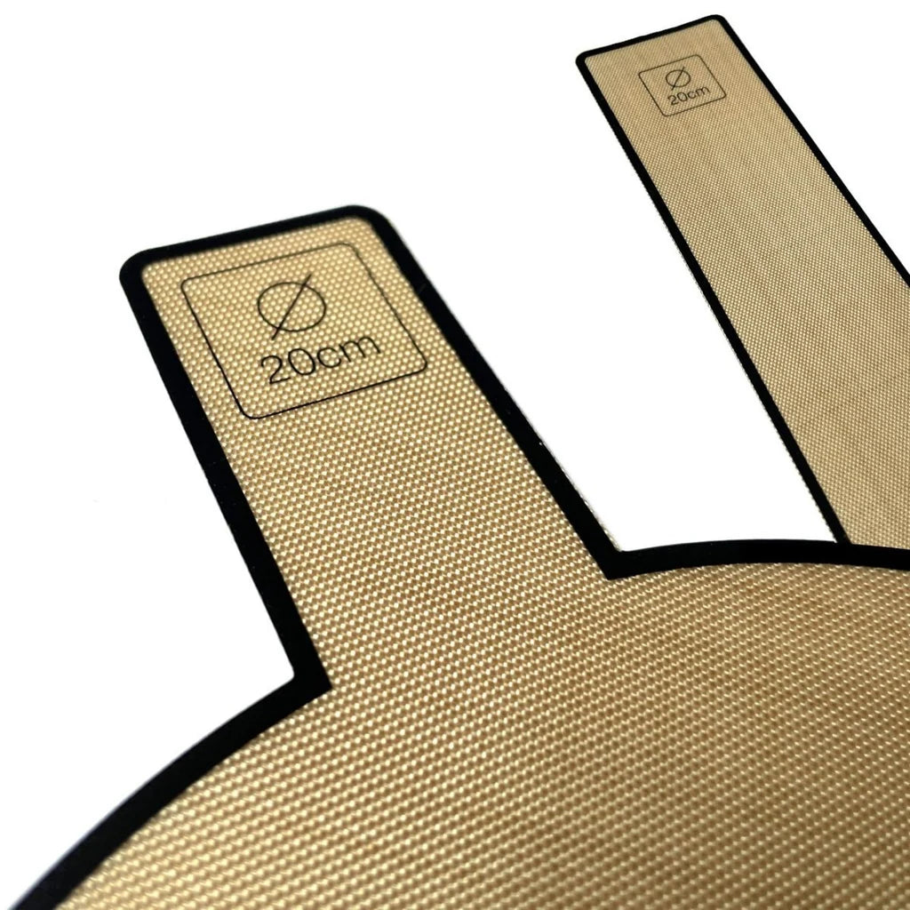 Detalj av bakepapir for Ø20cm form med håndtak og størrelsesmerking