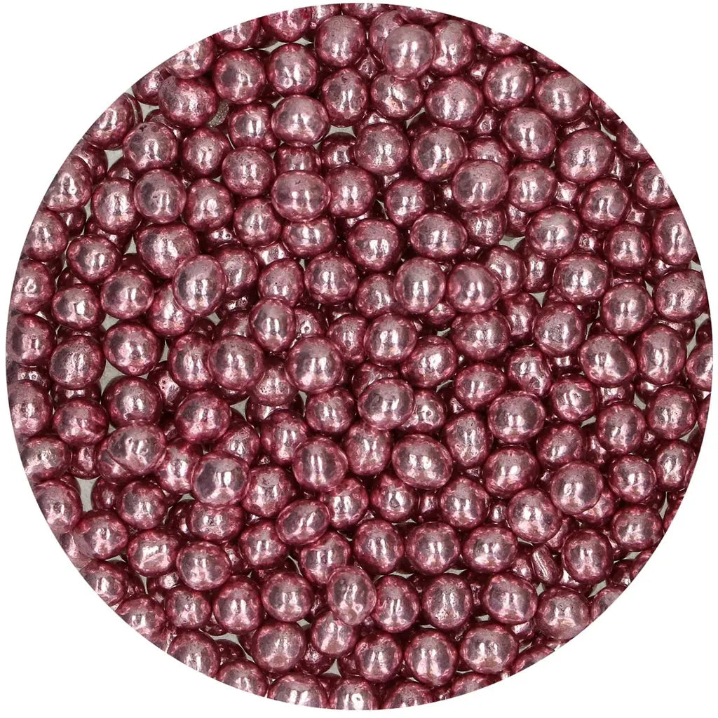 Nærbilde av FunCakes sprø sjokoladeperler i rosa metallic