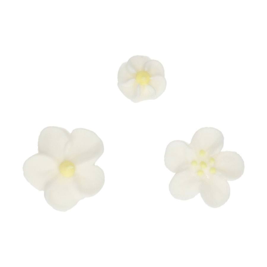 spiselig kakepynt av gule og hvite blomster