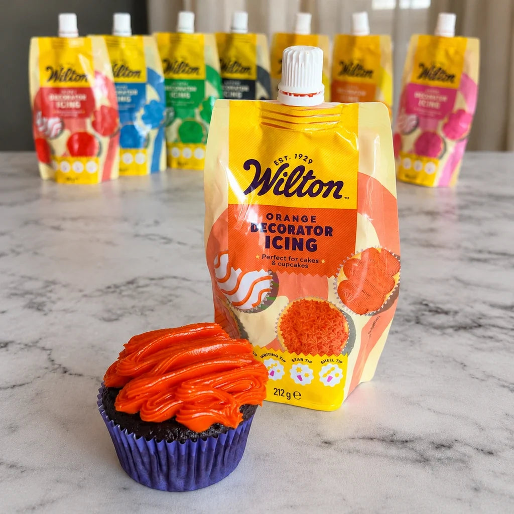 Wilton oransje frosting med dekorert cupcake
